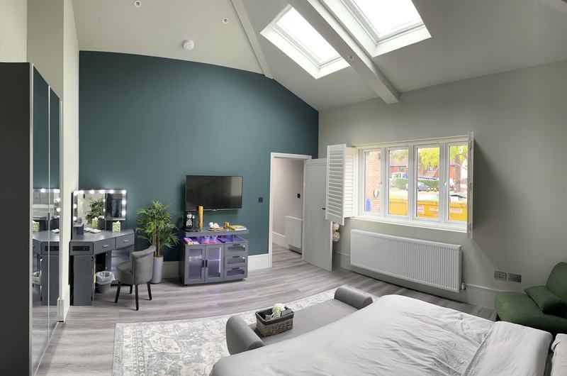 Bedroom with rooflights and vaulted ceiling