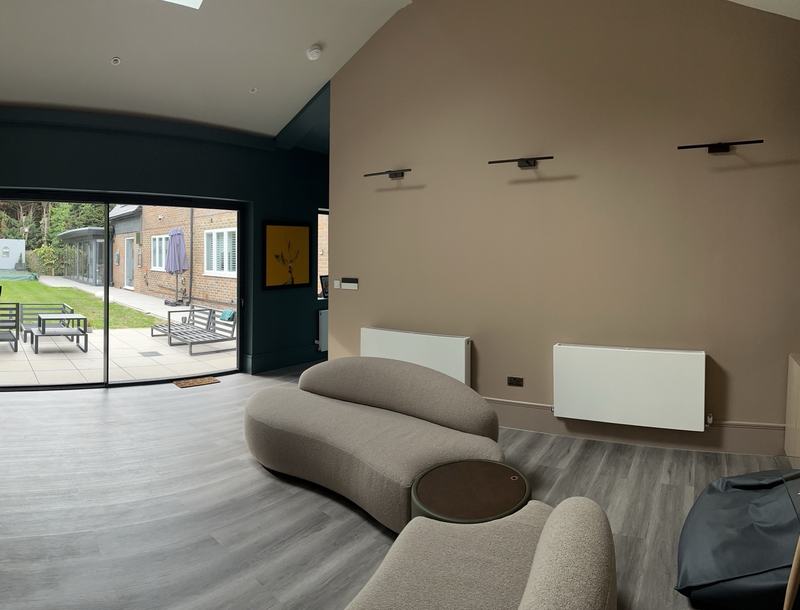 Open-plan room with sliding doors onto the garden